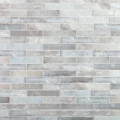 a white and gray brick wall with no mortars