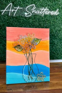 a painting that has flowers in a vase on top of a wooden table with the word art shattered above it