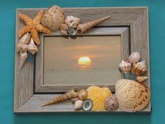 the frame is made out of wood and has seashells on it, including starfish