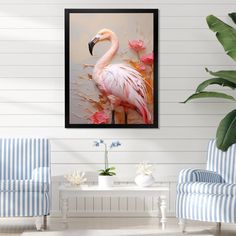 a pink flamingo standing in front of a white wall next to two blue chairs