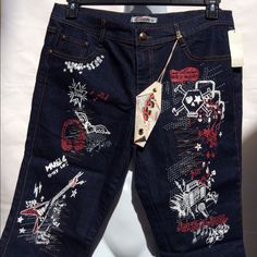 Dark Blue Denim Jeans With Rock Star Images. Cropped, 95% Cotton, 12% Polyester, 3% Spandex Punk Style Denim Blue Jeans, Denim Blue Graphic Print Denim Bottoms, Denim Blue Graphic Print Bottoms, Graphic Print Denim Bottoms In Denim Blue, Denim Blue Bottoms With Graphic Print, Medium Wash Denim Bottoms With Graphic Print, Graphic Print High Waist Denim Jeans, Graphic Print Dark Wash Denim Jeans, Dark Wash Denim Jeans With Graphic Print