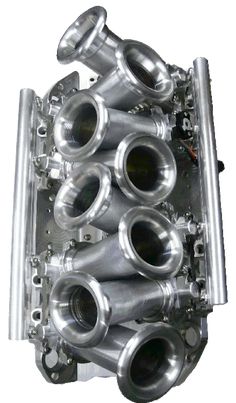 an engine block is shown with four different parts in it's center and the top part