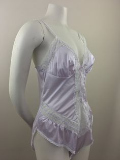 "Vintage 1980's lavender teddie has lace accents on the straps, chest/bodice, and hips; lace-up front closure; and crotch snap (3) closure. Made in USA The condition of this item = Excellent BRAND: Vassarette a Division of Munsingwear, Inc. SIZE: 36 Medium Note: Vintage items are typically sized differently from modern sizes; please review the Measurements section below to ensure an accurate fit. MEASUREMENTS Bust, waist, and hip measurements have been doubled. Shoulder (shoulder seam to shoulde Mafia Princess, Princess Clothing, Satin Teddy, Purple Bodysuit, Urban Cowgirl, Purple Lingerie, Cowgirl Chic, Grandpa Sweater, New Chic