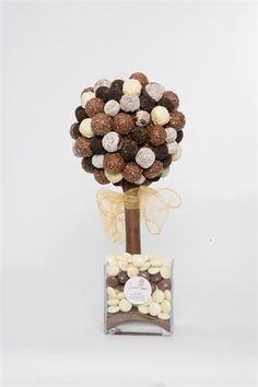 a vase filled with lots of chocolates and nuts