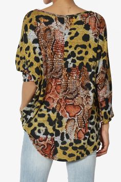 Printed Dolman Sleeve Pullover Top – Effortlessly stylish, this lightweight, stretch Hacci knit top features chic leopard, floral, polka dot, and chevron prints. With a relaxed fit, hi-low hem, and boat neck, it’s perfect for casual wear, office days, or travel. Wear with skirts or tailored pants or denim for versatile, everyday style. Lightweight Draped Knit Top – Featuring trendy leopard, floral, chevron and polka dot prints for casual or travel looks. Comfortable 3/4 Sleeve Pullover – Perfect Oversized All Over Print Tops For Spring, Oversized Spring Tops With All Over Print, Oversized Tops With All Over Print For Spring, Fall Multicolor Mixed Print Tops, Oversized Leopard Print Top, Fall Graphic Print Blouse For Day Out, Trendy Multicolor Rayon Tops, Leopard Print Tops For Spring, Trendy Bold Print Blouse For Fall