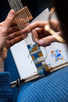 a person is working on a weaving project