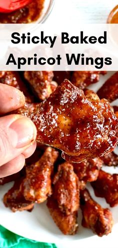 A hand holding up a Sticky Baked Apricot Wing over a white platter of more wings Spicy Apricot Glazed Wings, Apricot Chicken Wings, Turkey Wing Recipes Baked, Best Wing Sauce, Orange Marmalade Chicken, Chicken Wing Flavors, Healthy Chicken Wings, Chicken Wing Marinade