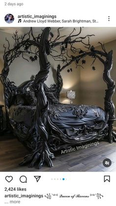 the bed is made out of wood and has black branches on it, as well as an intricate headboard