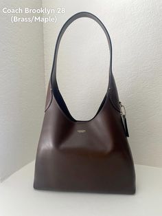 #coach #brooklynbag #shoulderbag #trending #fashion #purses #leather Coach Brown Shoulder Bag For Fall, Everyday Luxury Coach Hobo Bag, Timeless Coach Shoulder Bag, College Bag Aesthetic, Coach Brooklyn Shoulder Bag, Big Purse, Chic Brown Coach Shoulder Bag, Coach Bags Aesthetic, Coach Brown Hobo Shoulder Bag