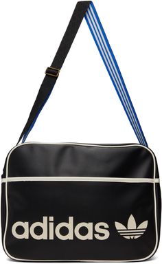 Grained faux-leather messenger bag in black. Contrast trim in white throughout. · Adjustable logo-woven grosgrain shoulder strap · Logo printed at face · Zip pocket at face · Zip closure · Patch pocket at interior · Satin lining in blue · H11 x W15 x D4.5 in Supplier color: Black Adidas Bags, Material Girl, Original Clothes, Black Shoulder Bag, Leather Messenger Bag, Material Girls, Leather Messenger, Adidas Black, Sport Bag