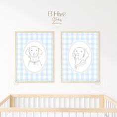 two framed dogs are on the wall above a crib