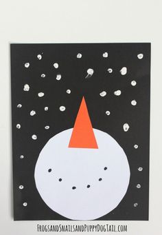 a black and white card with an orange hat on it