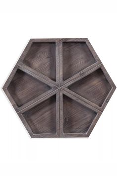 an octagonal wooden tray with four sections