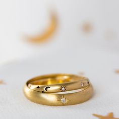 Step into the galaxy with this alternative his and hers wedding band set, the perfect choice for a celestial wedding, showcasing a beautiful 14K/18K crescent moon and diamond stars ring.This chic, constellation band set, will celebrate your everlasting love.   It is a blend of elegance and craftsmanship,  the perfect way to love someone to the moon (and back).Materials & Colors:*********************✤ 14K OR 18K yellow/rose/white gold. Please select your favorite color from the drop-down menu Sun And Moon Wedding Bands, Galaxy Wedding Ring, Elegant Wedding Rings With Sun And Moon Design, Crescent Shaped Yellow Gold Wedding Rings, Magical Moon Phase Jewelry For Wedding, Gold Moon Phase Rings For Wedding, Gold Wedding Rings With Moon Phase Detail, Celestial Crescent Wedding Rings, Wedding Celestial Crescent Rings