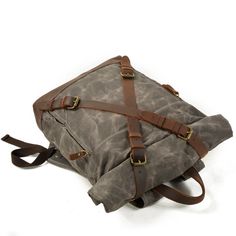 Embrace your adventurous spirit with our rugged and stylish vintage canvas and leather rucksack. Designed for the modern adventurer, this backpack combines classic design with practical features to support your journeys, whether in the city or the wilderness. Rugged Comfort: At just 1 kg, this 20-liter retro waxed rucksack offers lightweight comfort without compromising on durability. The padded shoulder straps ensure ease of carrying, even on longer trips. Modern Meets Tradition: The sleek desi Canvas Rucksack Backpack, Leather Travel Backpack, Wax Canvas, Waxed Canvas Backpack, Canvas Rucksack, Anti Theft Backpack, Leather Rucksack, Outdoor Backpacks, Practical Bag