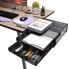 a computer desk with an open drawer underneath it