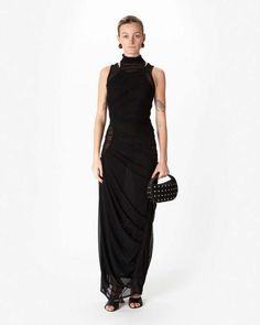 The layered mesh dress in black by coperni is a sleeveless high neck dress crafted from layers of stretch material with cutouts at the hips and shoulders.    -  slips on over head  - sleeveless  - 92% polyamide 8% elastane with 90% viscose 10% elastane contrast  - hand wash dry flat  - made in italy  -  #copr107557 Layered Mesh Dress, Layering Jacket, Black Mesh Dress, Textured Jacket, 21st Dresses, Favorite Daughter, Dress Crafts, Lulu Dresses, Mesh Dress