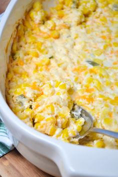 a casserole dish with corn and cheese in it