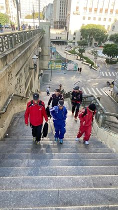 several people walking up and down some stairs