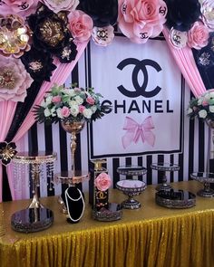 a chanel themed party with pink and black flowers