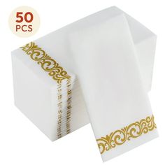 50 white napkins with gold trimming on each one side and the other half