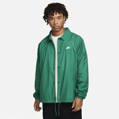 Keep your look clean and classic in this coach's jacket from our Nike Club collection. Roomy through the body and sleeves, the relaxed fit is paired with smooth woven fabric and soft cotton lining to bring casual comfort to any outfit. Pair it up with some retro Nike sneakers for a stylish look that works just about anywhere. Classic Long Sleeve Windbreaker, Classic Green Outerwear With Ribbed Cuffs, Nike Cotton Casual Track Jacket, Nike Cotton Track Jacket Casual Style, Casual Nike Cotton Track Jacket, Casual Collared Outerwear For College, Nike Relaxed Fit Winter Outerwear, Nike Relaxed Fit Outerwear For Winter, Nike Winter Outerwear With Relaxed Fit