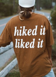 Do you love to hike?  Then this tee is made perfectly for you!!  Tee is super comfy and 100% USA cotton.  Durable with a generous fit.  Normal size for loose comfortable fit. Size up for baggy fit, perfect over shorts or leggings.  Show everyone you Hiked it and Liked it. 🖤 100% USA cotton  🖤 Unisex Fit 🖤 Pre-Shrunk 🖤 Outdoorsy Style Summer, Pnw Style, Outdoorsy Style, Granola Girl Aesthetic, Graphic Tee Style, Shirt Logo Design, Slogan Design, Slogan Tshirt, Trendy Graphic Tees