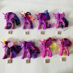 the little pony toys are lined up on the table