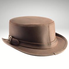 Fitted Brown Top Hat With Flat Brim, Fitted Brown Top Hat With Short Brim, Brown Fitted Top Hat With Flat Brim, Fitted Brown Brimmed Top Hat, Classic Brown Top Hat For Kentucky Derby, Classic Brown Top Hat With Flat Brim, Brown Leather Brimmed Fedora, Classic Leather Fedora With Flat Crown, Brown Mini Hat With Short Brim For Rodeo