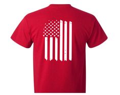 RED Remember Everyone Deployed Unisex Short Sleeve Shirt. In honor of our Deployed Service Members, this shirt is perfect for anyone and everyone! 'RED shirt Friday' is a tradition to show your support for our deployed military members. This two sided short sleeve shirt has RED on the front of the shirt with Remember Everyone Deployed as part of the letters. The back of the shirt has a distressed (weathered) looking flag. This is a red colored shirt with high quality white vinyl applied. Sizes a Red Short Sleeve Tops Made In Usa, Patriotic Red Pre-shrunk Shirt, Patriotic Red Tops For Memorial Day, Red Cotton Shirt For Memorial Day, Red Patriotic Shirt For Memorial Day, Red Shirt With American Flag Print For Memorial Day, Red American Flag Print Top For Labor Day, Red American Flag Print Shirt For Memorial Day, Red American Flag Shirt For Memorial Day