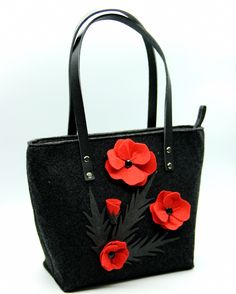 The unusual design of this model of a women's bag will win the heart and attract the attention of any fashionista. The model we presented has ideal parameters and excellent spaciousness, it will perfectly fit all the things you need. The bag was made of delicate, velvety material, which in combination with leather handles looks very extravagant. The highlight of the bag is luxurious red poppies. The handbag will go well with clothes in dark colors with the addition of bright red color, it will become just an idyll of color combination. DIMENSIONS: Width 40 cm (15,7 inches) Height 28 cm (11 inches) Thickness 14 cm (5,5 inches) Handmade Everyday Flower Bag, Everyday Felt Tote Bag, Handmade Felt Bag For Daily Use, Rectangular Felt Bags As Gifts, Rectangular Felt Bags For Gifts, Daily Use Rectangular Felt Shoulder Bag, Rectangular Felt Travel Bag, Rectangular Felt Shoulder Bag For Daily Use, Rectangular Felt Bags For Daily Use