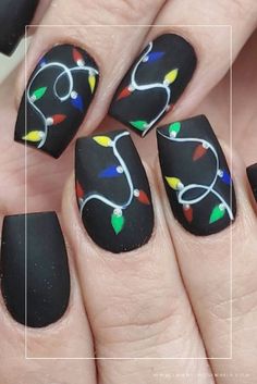 Elevate your holiday look with these 40+ stunning black Christmas nail designs! Whether you prefer long or short nails, acrylic or gel, we've got creative ideas for every nail shape. Get inspired with these amazing nail art designs featuring shades of white, red, gold, green, and silver. From cute and simple to bold and intricate, we've got everything you need to complete your winter look. Don't miss out on these amazing ideas and get ready to show off your stunning black Christmas nail designs. Black Christmas Nail Designs, Black Christmas Nails, Winter Christmas Nails, Amazing Nail Art Designs, Amazing Nail Art, Light Nails, Christmas Nails Easy, Cute Christmas Nails, Christmas Gel Nails