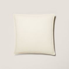 a white pillow on a gray background