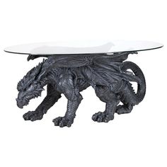 a glass table with a black dragon on it