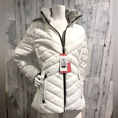 Brand New With Tags Nautica Quilted Jacket. It Has The Softest Faux Grey Fur Lined Detachable Hood. Front Zipper Pockets. It Has Black Knit Cuffs With Thumb Holes. The Side Has A Stretch Panel ( See Pic) Size Medium Shoulder To Hem In Front 26” Sleeve Length Including Cuffs Aprox 25” Pit To Pit In Front 21” Excellent New Condition White Weatherproof Winter Outerwear, Winter Weatherproof White Outerwear, White Weatherproof Long Sleeve Outerwear, White Weatherproof Fall Outerwear, White Casual Outerwear With Faux Fur Trim, Casual White Outerwear With Faux Fur Trim, Casual White Weatherproof Outerwear, White Fitted Outdoor Outerwear, Fitted White Outerwear For Outdoor