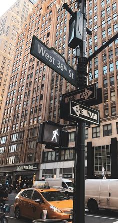 a street sign on the corner of west 30th st and one way