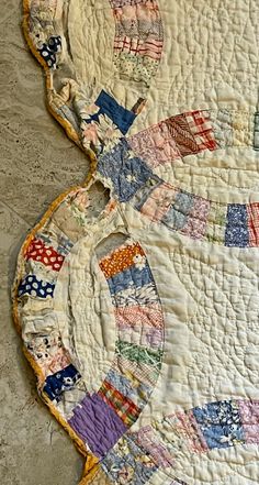 two quilts are laying on the floor next to each other and one is made from old fabrics