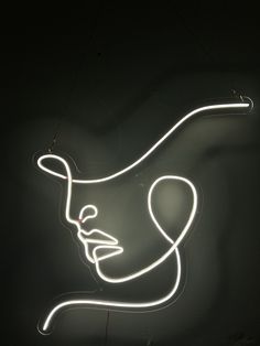 a neon sign with a man's face on it