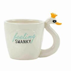 a white coffee mug with a ducky head on the side and words saying baking swany