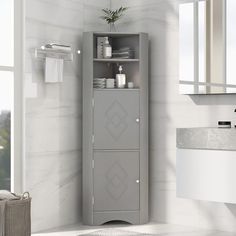 a bathroom with a gray cabinet and white sink