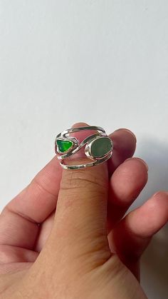 The seaglass is handpicked from the southwest coastlines England. the bigger seaglass will be 5-10mm and the smaller one will be 3-6mm in size. The seaglass are randomly selected, if you require a certain colour for your seaglass, please message me and I'll try my best to accommodate!  The width of your seaglass ring will be around 2cm, making a huge satement piece to wear.  All rings are custom made to order, so please allow me up to 3 days to finish your ring. I'll get your ring shipped as soo Seaglass Rings Diy, Seaglass Wedding Ring, Seaglass Ring Engagement, Adjustable Sea Glass Ring Jewelry, Handmade Adjustable Sea Glass Rings, Sea Glass Ring, Glass Rings, Perfume Spray, Color Ring