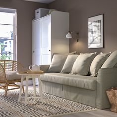 a living room filled with furniture next to a window