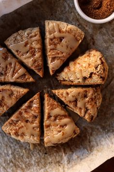 several slices of cake on a plate with cinnamon sprinkles next to it