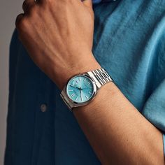 Redefine sophistication with the modern sports design of this men's Citizen Tsuyosa Collection automatic watch with a light blue sunray dial. The sky-blue sunray dial showcases luminous silver-toned hands and markers, and a date display at 3 o'clock. 40.0mm brushed stainless steel case with anti-reflective sapphire crystal Automatic movement keeps accurate time. The stainless steel bracelet features polished and brushed links and secures with a fold-over clasp. Water resistant to 50 meters, this watch includes a 5-year limited manufacturer warranty, with an additional 1-year warranty when you register your watch with Citizen. We are an authorized Citizen dealer. Modern Blue Automatic Watch Accessories, Modern Blue Watch With Subdials, Modern Blue Chronograph Watch, Blue Watch With Metal Rectangular Dial, Modern Blue Watch With Metal Dial, Modern Blue Watch Accessories With Metal Dial, Modern Blue Watches With Analog Display, Blue Watch With Rectangular Dial And Analog Display, Blue Watch With Analog Display And Rectangular Dial