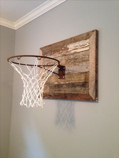 a basketball hoop hanging from the side of a wall with an instagram post underneath it