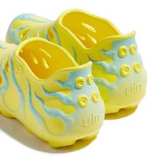 a pair of yellow and blue shoes sitting on top of each other