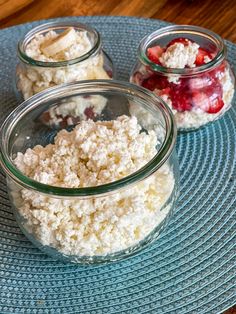 three jars filled with food sitting on top of a blue plate