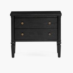 a black nightstand with two drawers on one side and brass knobs on the other