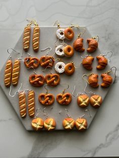 an assortment of donuts and pretzels on a tray