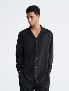 Our premium collection. Elevated loungewear with a luxurious feel, this sleep button-down shirt is crafted from a cotton modal stretch blend for an extra soft touch. Designed with long sleeves and a notch collar. Styled with drop shoulders for a relaxed, effortless fit.  Material: 55% Cotton, 37% Micro Modal, 8% Elastane. Calvin Klein Modern Relaxed Fit Tops, Casual Calvin Klein Shirt With Spread Collar, Calvin Klein Casual Shirt With Spread Collar, Calvin Klein Long Sleeve Shirt With Button Closure, Casual Calvin Klein Tops For Loungewear, Calvin Klein Casual Tops For Loungewear, Relaxed Fit Button-up Sleepwear, Collared Shirt For Loungewear In Fall, Collared Shirt For Fall Loungewear